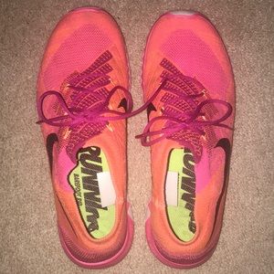 orange and pink nike barefoot rids!